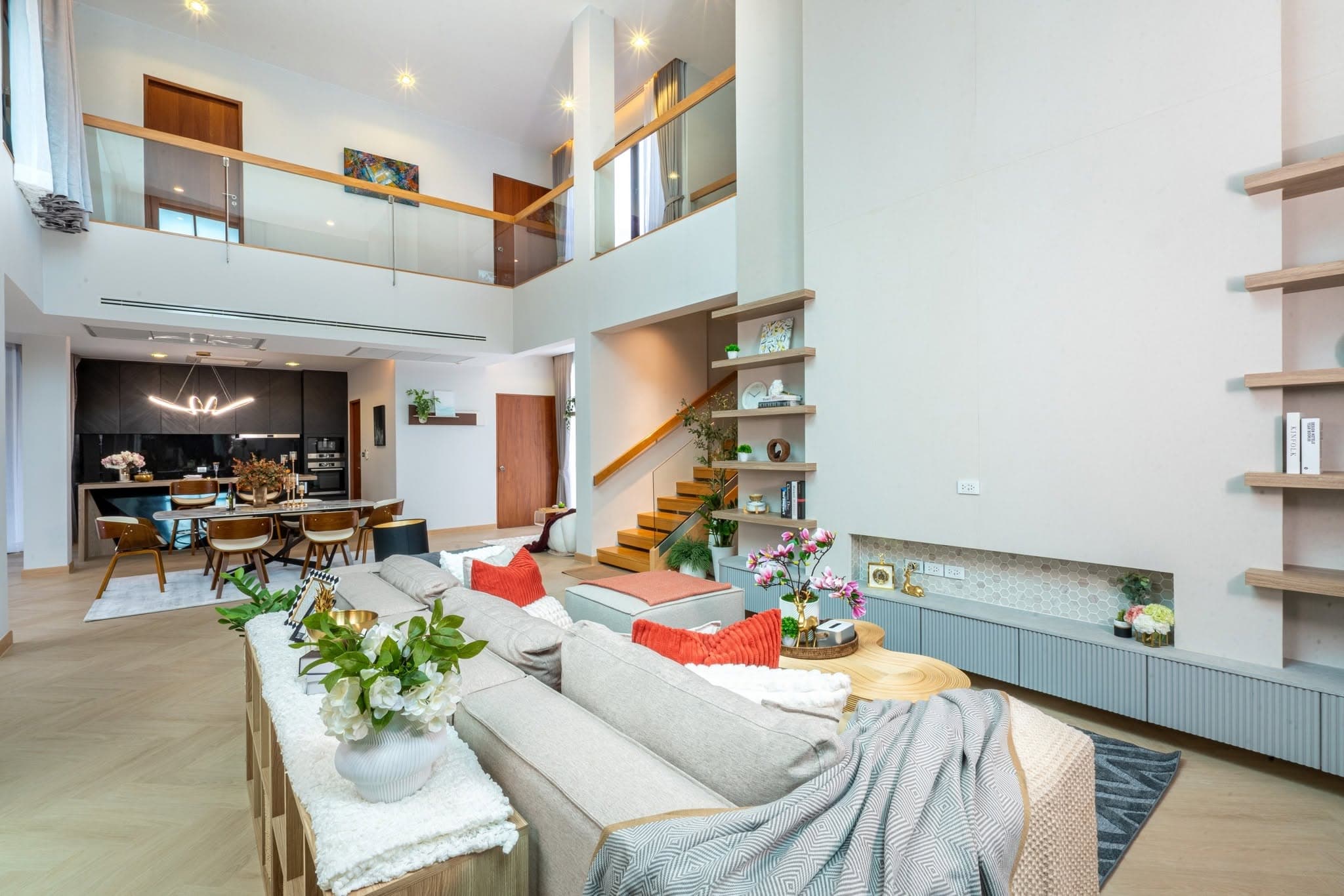 Double-height living room with staircase beyond