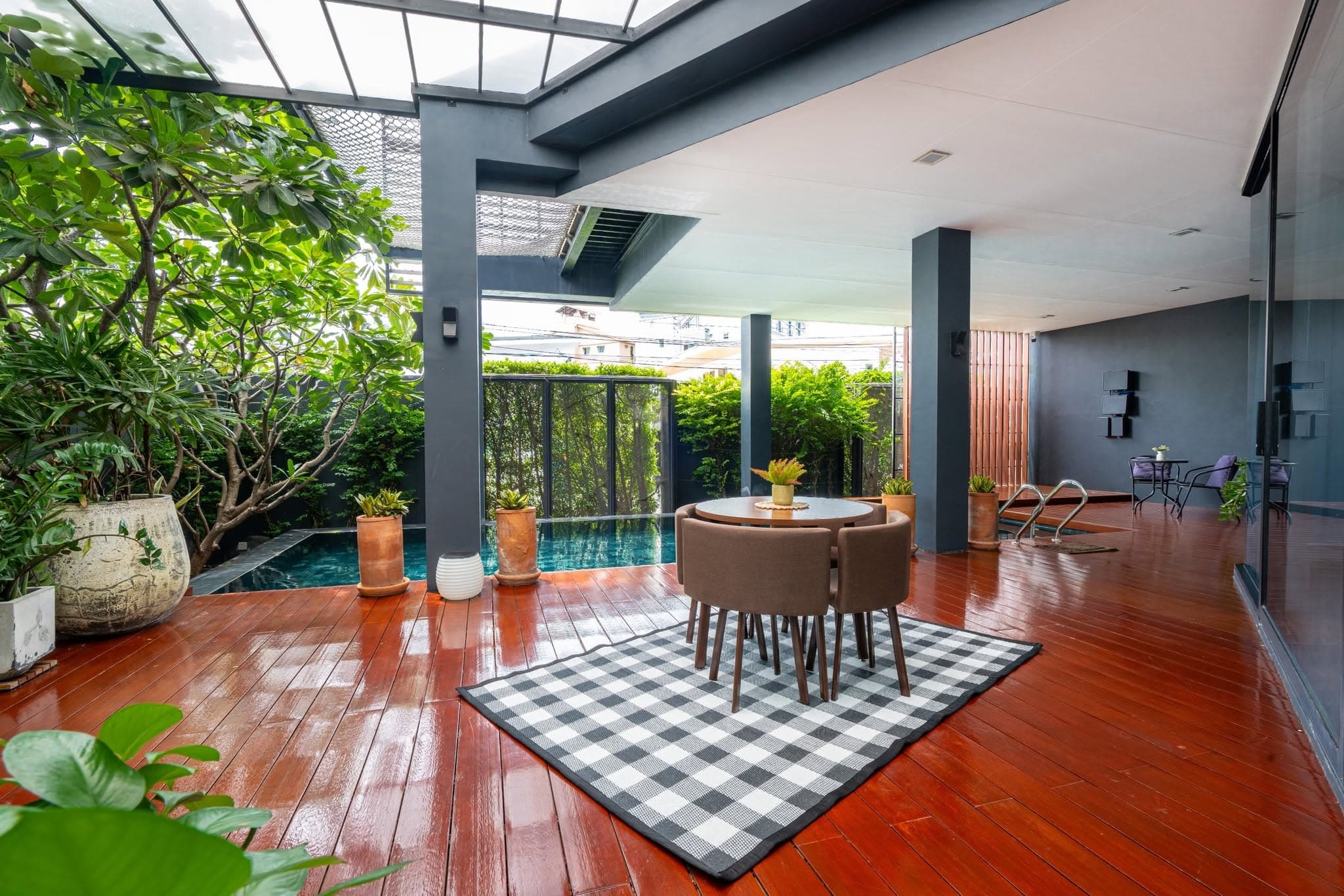 Covered teak deck beside the private pool