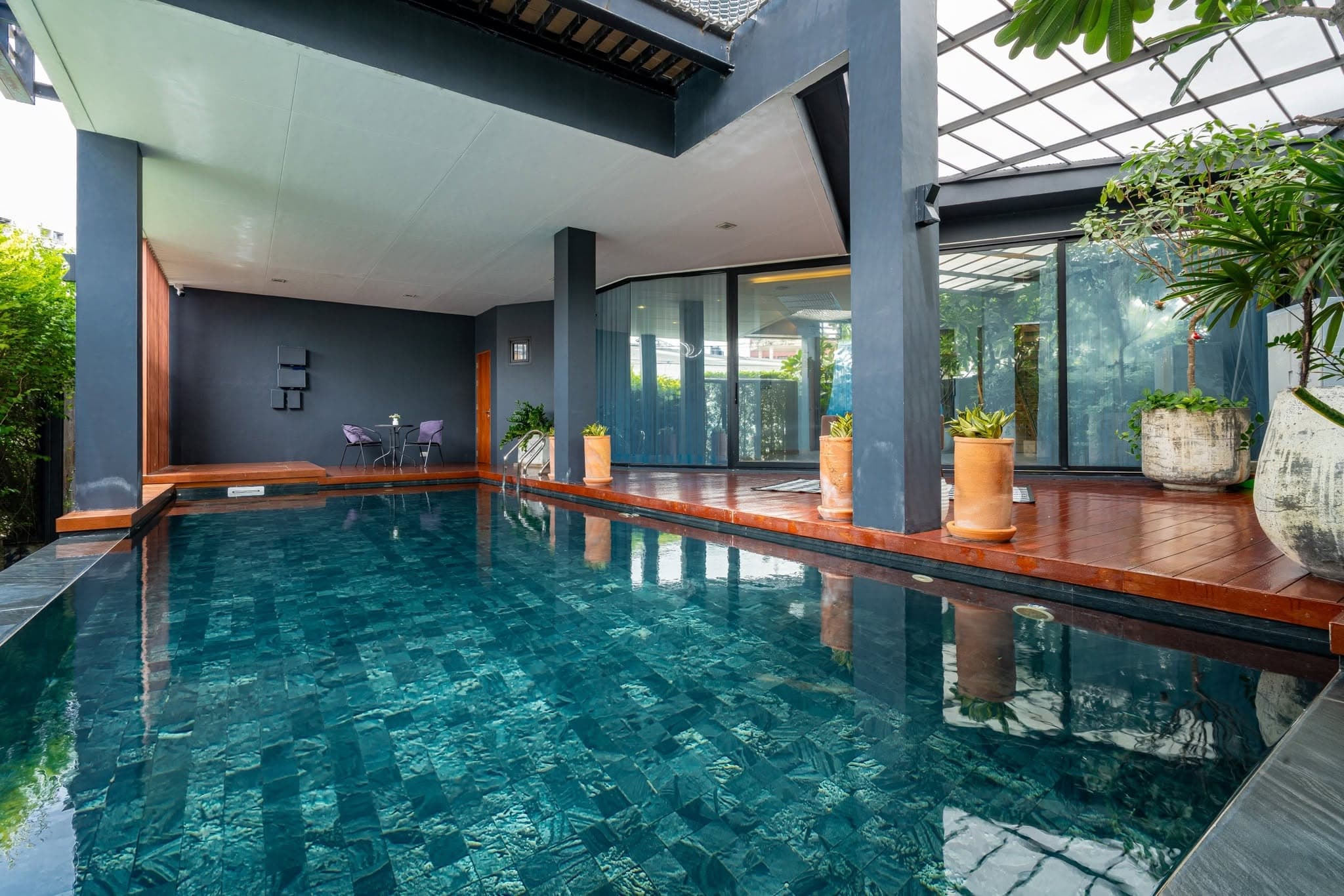 Private pool alongside full-height glazing