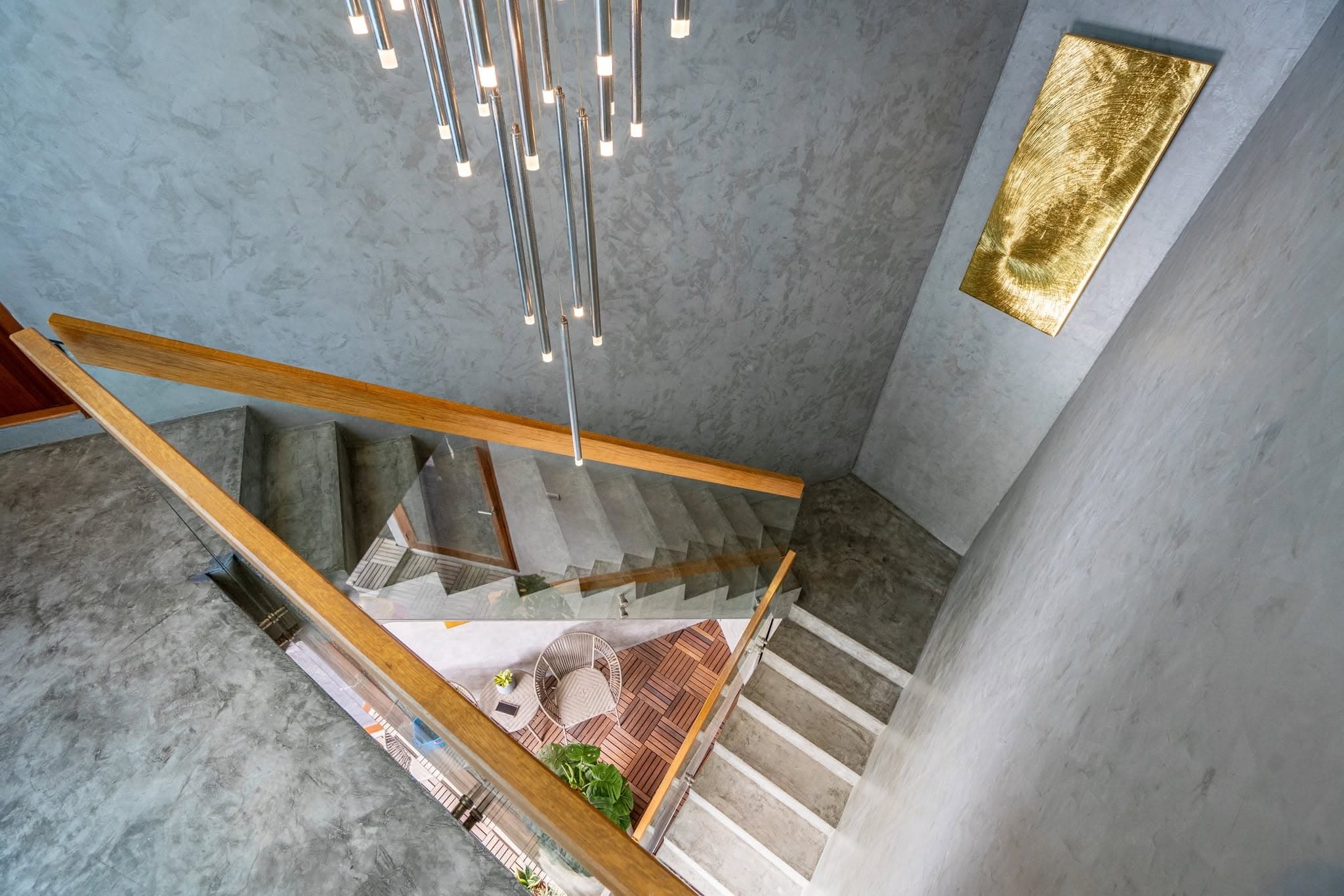 Stone stairwell with pendant lighting